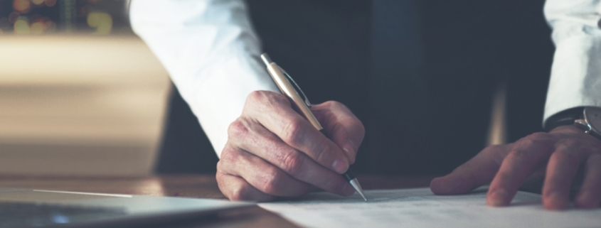 Close up business man signing contract making a deal classic business 1000x522 1